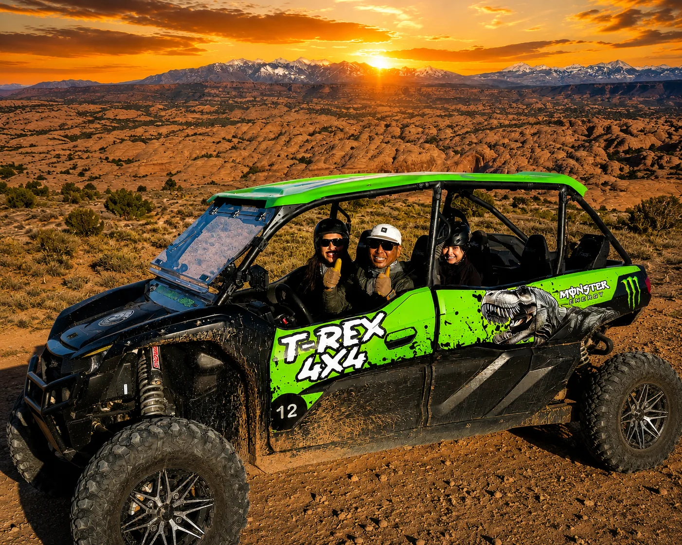 Travelers seated in a green Kawasaki UTV on rocky terrain