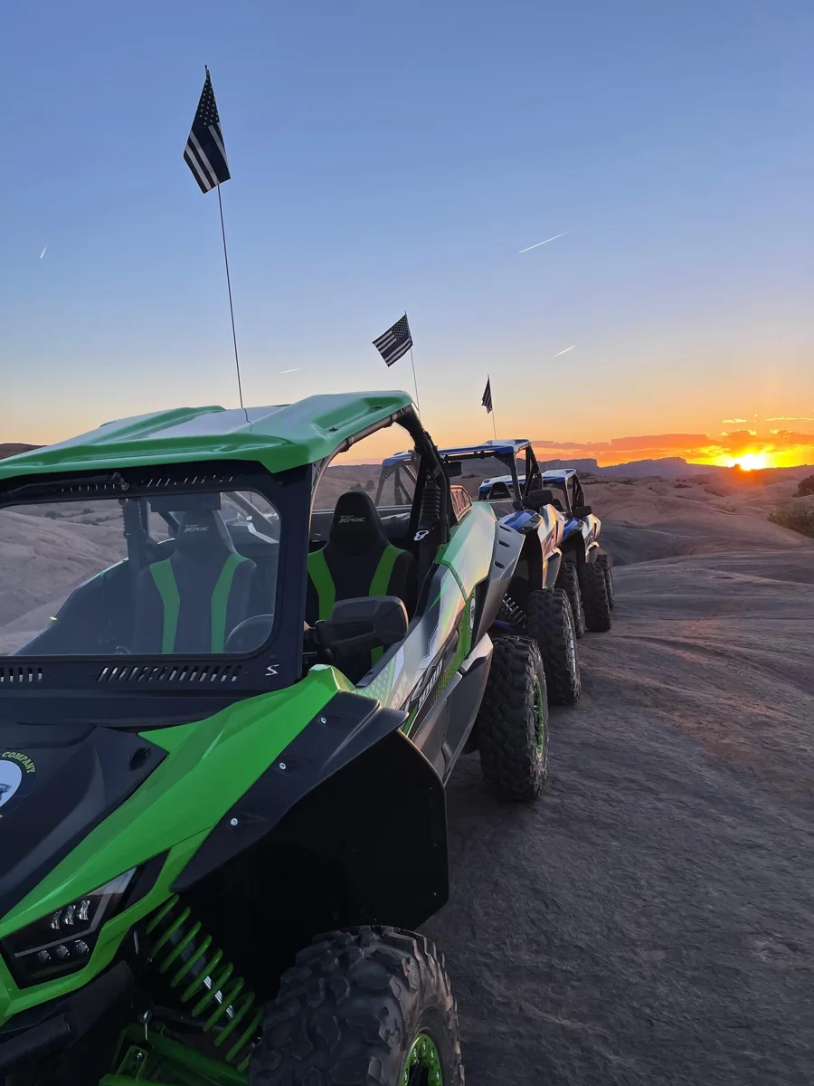 UTVs parked together in evening light
