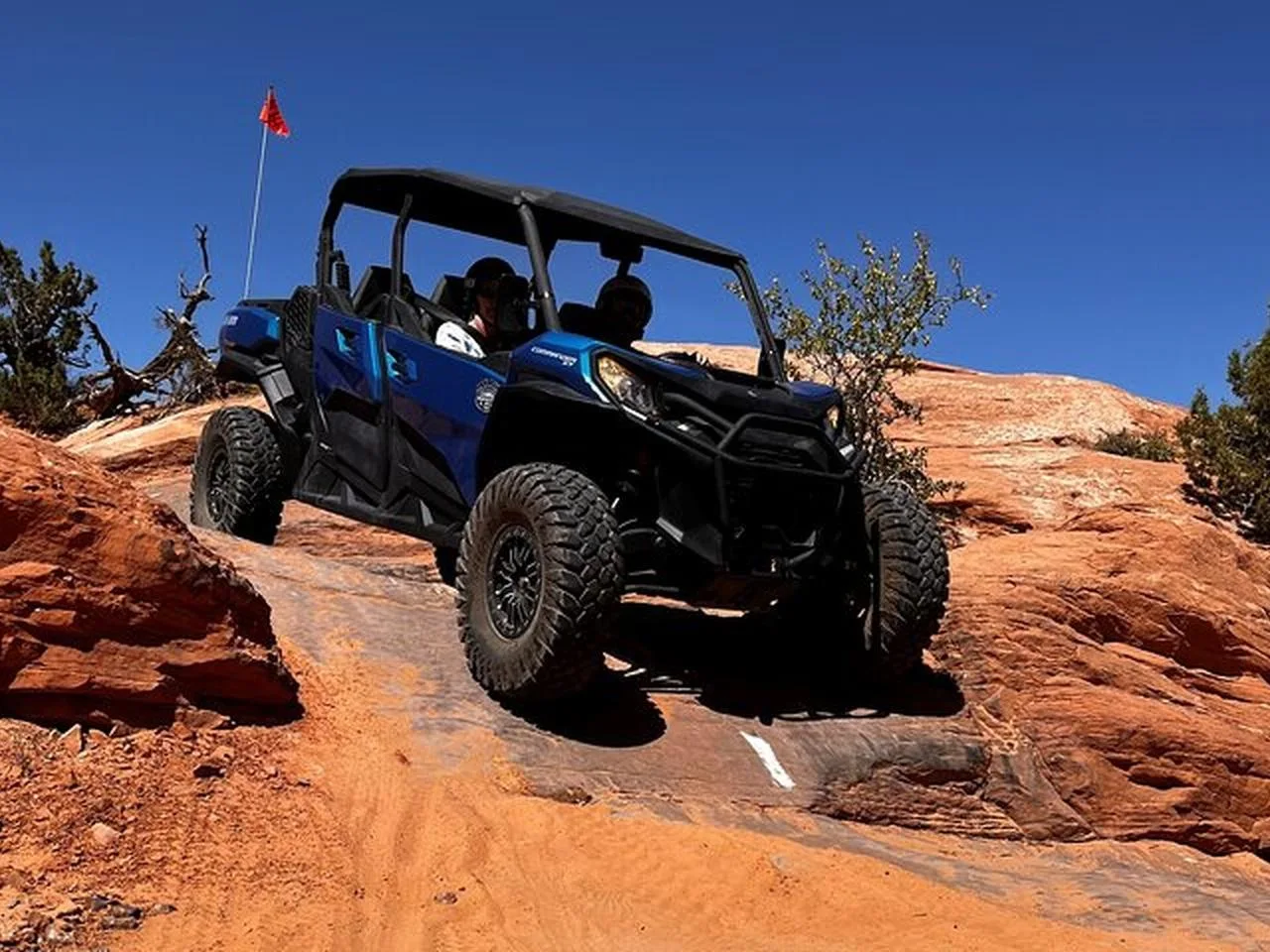 UTV negotiating a sandstone ledge