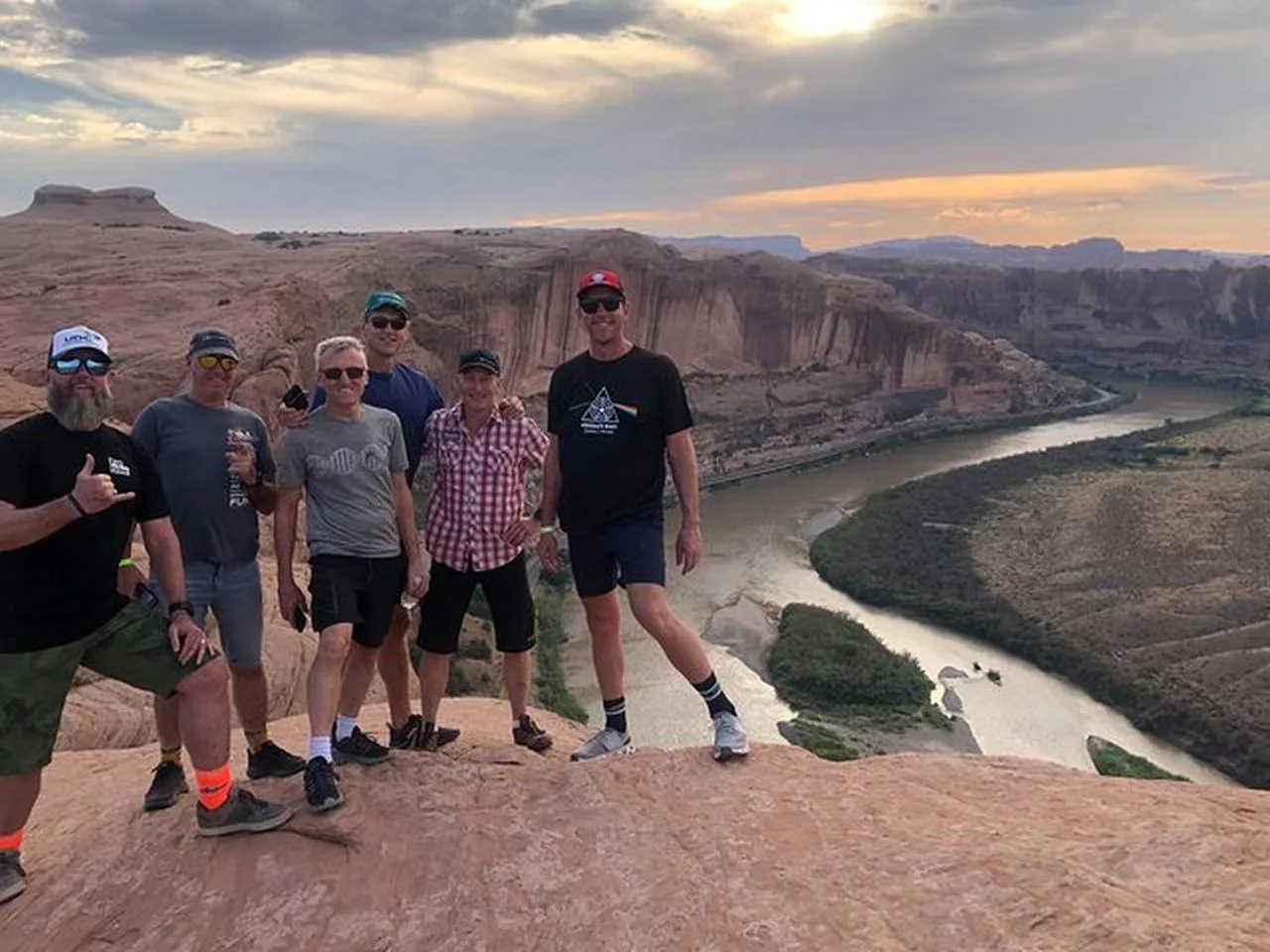 Travelers overlooking the Colorado River in evening light